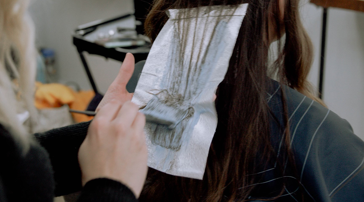 Woman getting hair color in Marion, Illinois and Herrin, Illinois at The Avenue Salon and Barber Shop.