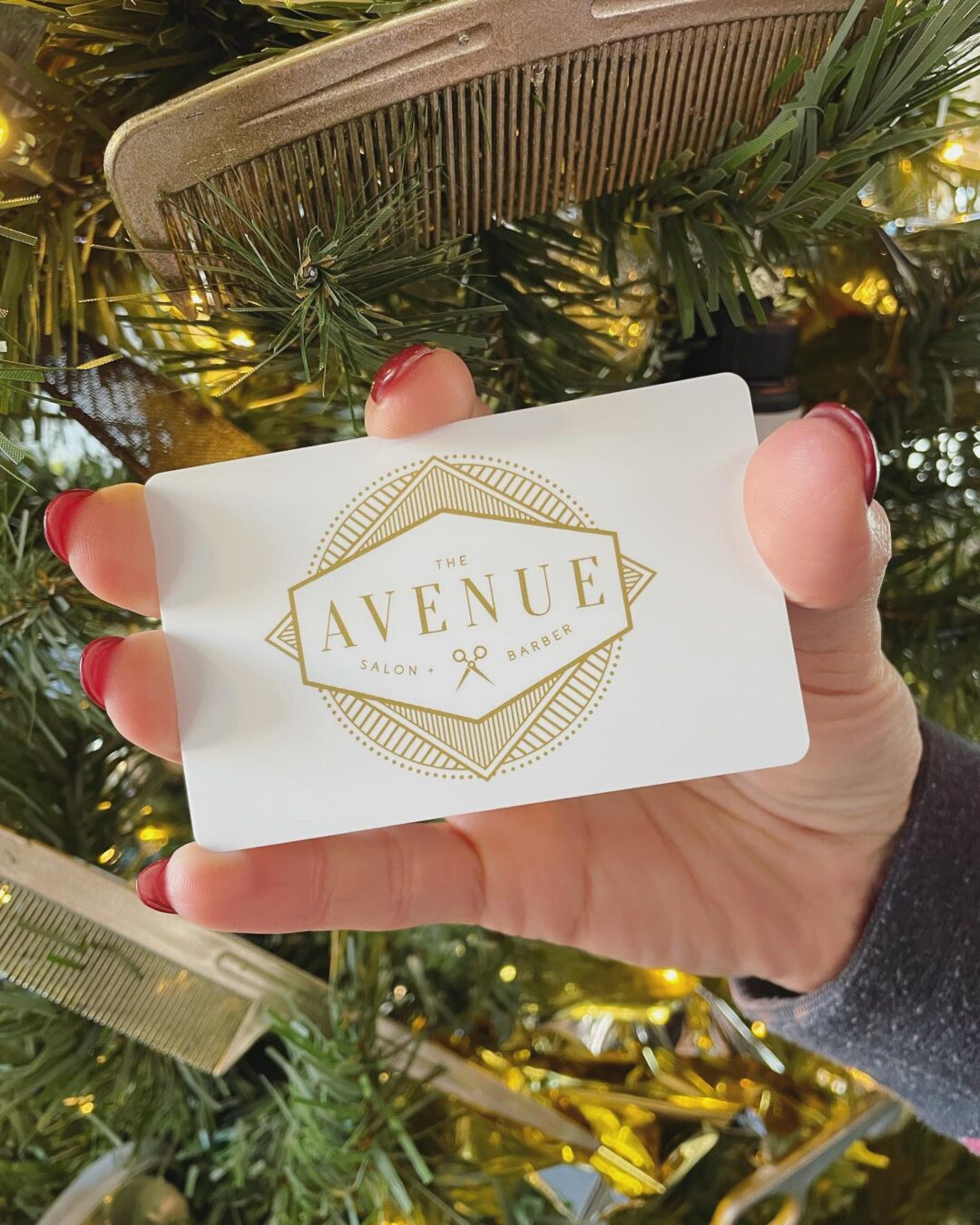 Avenue salon and barber shop gift card against a christmas tree