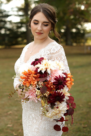 Bride posing with bouquet of flowers
