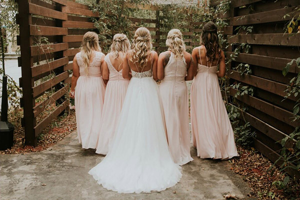 Back of bridal party's dresses and hair